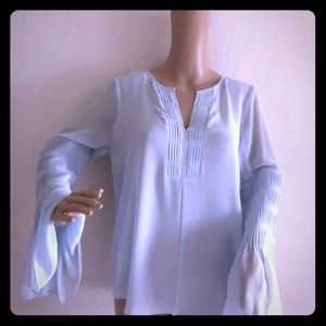 A Halston original made of sheer polyester,.